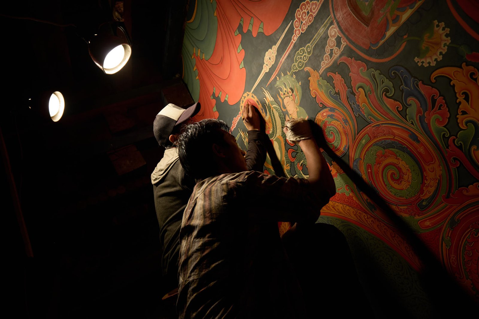 locals applying shading to wall paintings